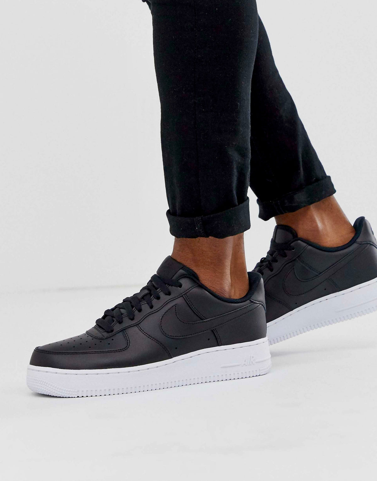 Nike Air Force 1 '07 "black leather upper with a contrasting white sole"