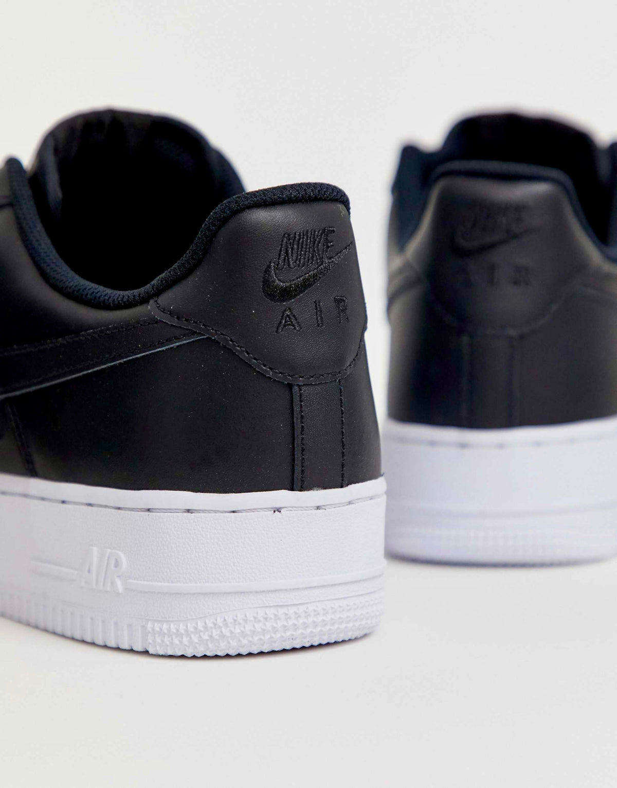 Nike Air Force 1 '07 "black leather upper with a contrasting white sole"