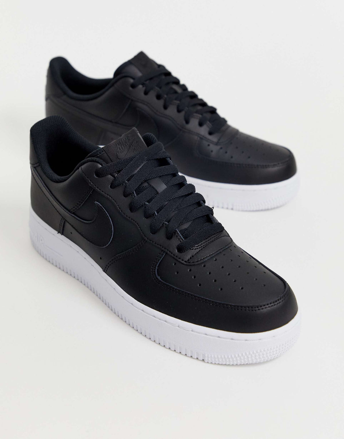 Nike Air Force 1 '07 "black leather upper with a contrasting white sole"